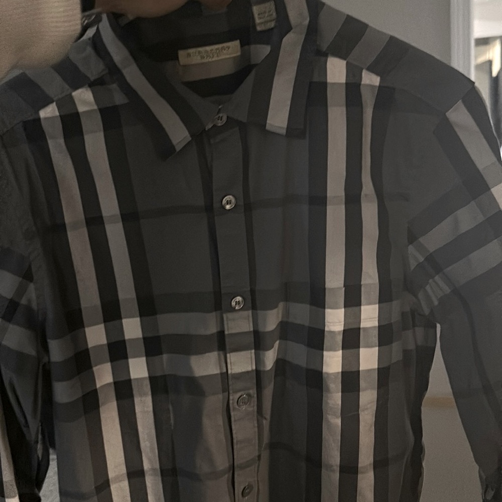 Like new Burberry shirt fits like small  awesome shirt doesn’t fit nor more